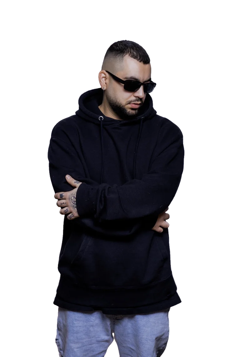 DJ Pettis N with arms crossed, wearing sunglasses and a black hoodie